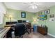 Bright home office with multiple monitors, comfortable seating, and personal touches creating an ideal workspace at 1225 Neapolitan Rd, Punta Gorda, FL 33983