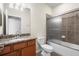 Bathroom featuring granite countertop vanity, a tub and shower combo at 12285 Canavese Ln, Venice, FL 34293
