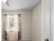 Bedroom with a window and patterned curtains, providing natural light at 12285 Canavese Ln, Venice, FL 34293