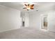 Spacious main bedroom with carpet flooring, neutral walls, and a ceiling fan at 12285 Canavese Ln, Venice, FL 34293