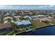 Home featuring a screened in lanai, pool and private dock on a canal at 1334 Via Milanese, Punta Gorda, FL 33950