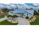 Aerial view of a charming home with a well-manicured lawn and beautiful landscaping at 1334 Via Milanese, Punta Gorda, FL 33950