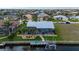 Home featuring a screened in lanai, pool and private dock on a canal at 1334 Via Milanese, Punta Gorda, FL 33950
