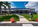 Lovely landscaped backyard and screened-in pool area, creating an ideal outdoor retreat at 1334 Via Milanese, Punta Gorda, FL 33950