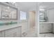 Well-lit bathroom with a single sink, large mirror, and a separate shower for added convenience at 1334 Via Milanese, Punta Gorda, FL 33950