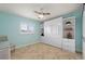 Bright, tiled bedroom with a murphy bed surrounded by built in shelving at 1334 Via Milanese, Punta Gorda, FL 33950