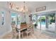 Bright dining area with a view of the pool, creating an ideal indoor/outdoor living experience at 1334 Via Milanese, Punta Gorda, FL 33950