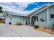 Charming single-Gathering home with light blue exterior, metal roof and manicured landscaping at 1334 Via Milanese, Punta Gorda, FL 33950