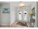 Welcoming foyer with decorative double doors, tile flooring, and neutral paint at 1334 Via Milanese, Punta Gorda, FL 33950