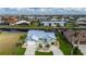 Inviting single Gathering home featuring mature palms, lush landscaping, and circular drive at 1334 Via Milanese, Punta Gorda, FL 33950