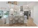 Modern kitchen featuring white cabinetry, stainless steel appliances, and a breakfast bar at 1334 Via Milanese, Punta Gorda, FL 33950