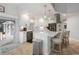 Contemporary kitchen with stainless steel appliances, quartz countertops, and breakfast bar seating at 1334 Via Milanese, Punta Gorda, FL 33950