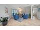 Inviting living room featuring comfortable seating, ceiling fan, and access to the outdoor pool area at 1334 Via Milanese, Punta Gorda, FL 33950
