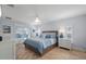 Serene bedroom with tile floors, a ceiling fan, and access to the outdoor patio at 1334 Via Milanese, Punta Gorda, FL 33950