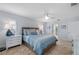 Comfortable bedroom with tile floors, accent lighting, and access to the en-suite bathroom at 1334 Via Milanese, Punta Gorda, FL 33950