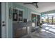 Outdoor kitchen area with stainless steel sink, mini fridge and cabinets at 1334 Via Milanese, Punta Gorda, FL 33950