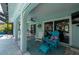 Inviting screened patio featuring comfortable Adirondack seating and a view of the pool at 1334 Via Milanese, Punta Gorda, FL 33950