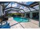 Beautiful caged pool with a view of the house and a covered patio area with nice furniture at 1334 Via Milanese, Punta Gorda, FL 33950