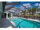 Covered pool with views of the canal and lots of room for chairs and tables at 1334 Via Milanese, Punta Gorda, FL 33950