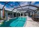 Wonderful caged pool with beautiful views of the backyard and neighboring canals at 1334 Via Milanese, Punta Gorda, FL 33950