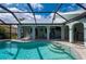 A swimming pool with several steps leads up to the beautiful covered patio at 1334 Via Milanese, Punta Gorda, FL 33950