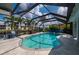 Gorgeous pool with screen enclosure, stunning canal views, and lots of room for entertaining at 1334 Via Milanese, Punta Gorda, FL 33950
