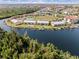 Aerial view of canal-front condos with community pool and boat docks for easy waterfront living at 1344 Rock Dove Ct # D102, Punta Gorda, FL 33950