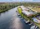 Aerial view of waterfront condos with boat docks, pools, and beautiful landscaping at 1344 Rock Dove Ct # D102, Punta Gorda, FL 33950