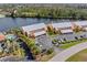 Aerial view of a condo with beautiful landscaping, a pool, and waterfront access at 1344 Rock Dove Ct # D102, Punta Gorda, FL 33950
