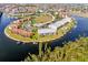 Aerial view of waterfront condos boasting boat docks, lush landscaping, and convenient parking at 1344 Rock Dove Ct # D102, Punta Gorda, FL 33950