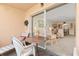 Balcony with outdoor seating area and sliding glass doors leading into the living room at 1344 Rock Dove Ct # D102, Punta Gorda, FL 33950