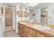 Bathroom featuring double sinks, wood cabinets, and a separate shower/toilet area at 1344 Rock Dove Ct # D102, Punta Gorda, FL 33950