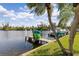 Dock on the water with kayaks, palm trees and boats docked at 1344 Rock Dove Ct # D102, Punta Gorda, FL 33950