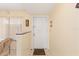 Bright foyer features neutral walls, tile floor, and staircase visible with coat rack and window at 1344 Rock Dove Ct # D102, Punta Gorda, FL 33950