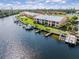A waterfront condo complex with private boat docks, and lush landscaping against a serene canal backdrop at 1344 Rock Dove Ct # D102, Punta Gorda, FL 33950