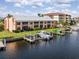 Waterfront condo featuring a private boat dock and lift, providing direct access to the waterways at 1344 Rock Dove Ct # D102, Punta Gorda, FL 33950