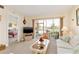 Cozy living room with lanai access showcasing waterfront views, next to the main bedroom at 1344 Rock Dove Ct # D102, Punta Gorda, FL 33950