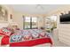 A well-lit bedroom with a view of the water, access to lanai, and a spacious layout at 1344 Rock Dove Ct # D102, Punta Gorda, FL 33950