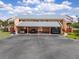 Covered parking area showing assigned spots for the complex's residents with tropical landscape at 1344 Rock Dove Ct # D102, Punta Gorda, FL 33950