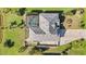 Birds-eye view of house with screened in pool and a well maintained yard at 1417 Carswell St, Port Charlotte, FL 33953