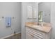 Bathroom featuring a sink with marble countertop, vanity, mirror, and tile floors at 1417 Carswell St, Port Charlotte, FL 33953