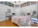 Comfortable bedroom with wood flooring and a decorative desk, and comfortable furniture at 1417 Carswell St, Port Charlotte, FL 33953