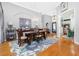 Elegant dining room features a chandelier, decorative rug, and hardwood floors at 1417 Carswell St, Port Charlotte, FL 33953