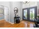 Inviting home foyer with stylish decor, hardwood floors, and an abundance of natural light at 1417 Carswell St, Port Charlotte, FL 33953