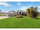 Well manicured lawn and beautiful home exterior with 2 car garage at 1417 Carswell St, Port Charlotte, FL 33953
