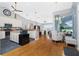 Open-concept kitchen with granite counters, stainless steel appliances and access to the living area at 1417 Carswell St, Port Charlotte, FL 33953