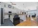 Eat-in kitchen with granite counters, stainless steel appliances, and a large, open layout at 1417 Carswell St, Port Charlotte, FL 33953