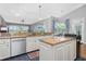 Kitchen features stainless steel appliances, light-colored cabinets, and stone countertops at 1417 Carswell St, Port Charlotte, FL 33953