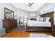 Spacious main bedroom boasts hardwood floors and access to the pool area at 1417 Carswell St, Port Charlotte, FL 33953
