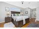 Spacious main bedroom boasts hardwood floors and well-lit at 1417 Carswell St, Port Charlotte, FL 33953